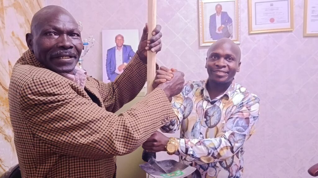 Jembe Mpya being given a jembe a tool of symbolism need for change Nakuru Town West