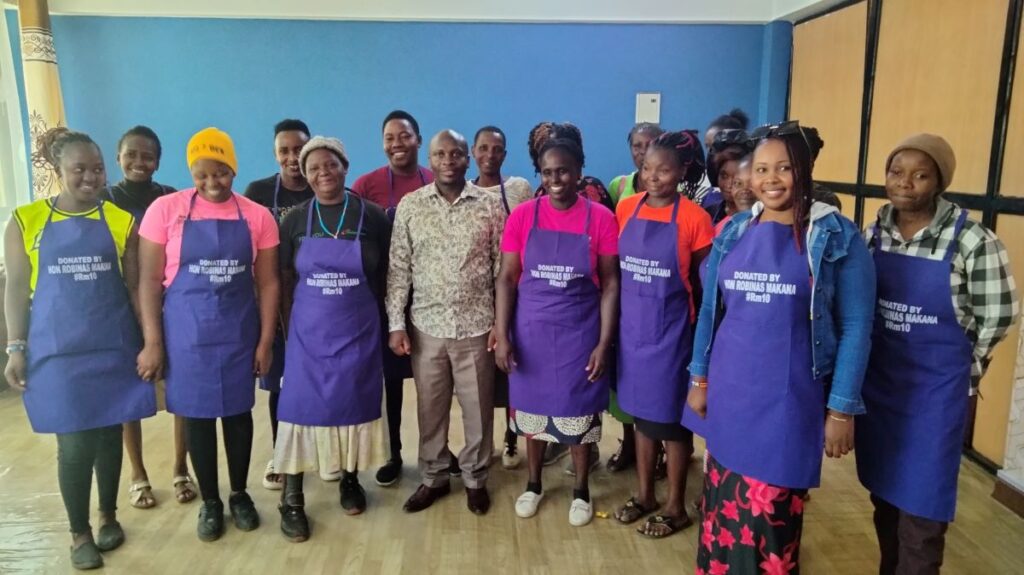 Mama mboga getting Donations from hon Robinas Makana